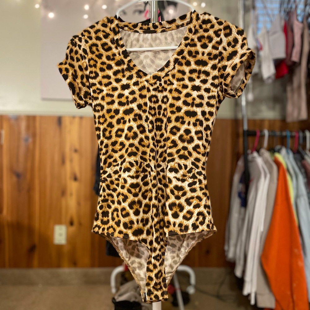 cheetah print body suit has been worn a few times.
